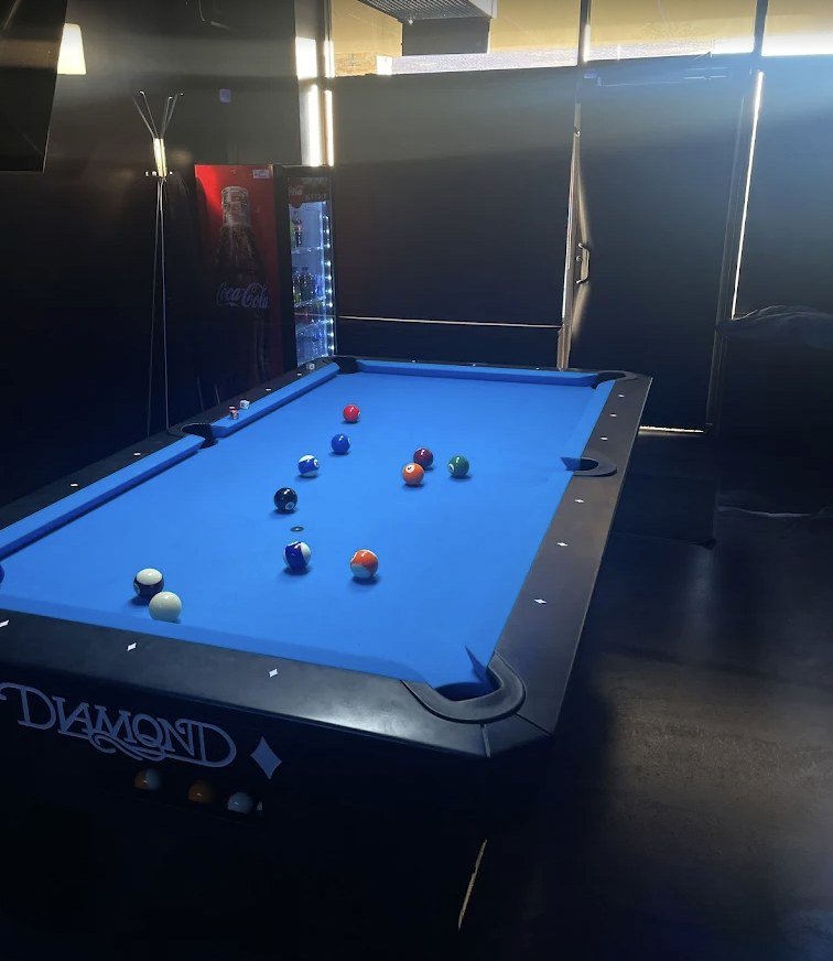 A Diamond pool table with blue cloth